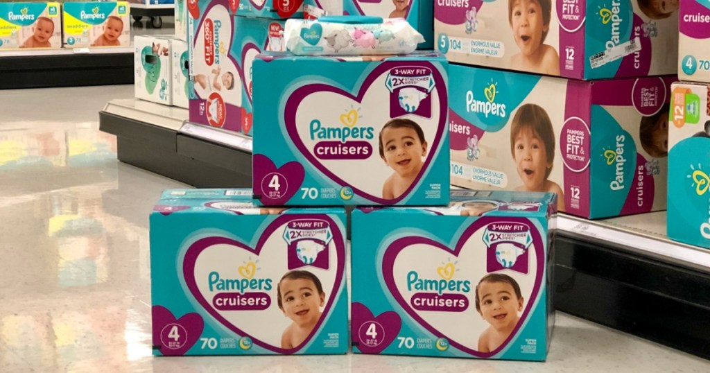 Pampers Super Packs stacked in pyramid with wipes on top