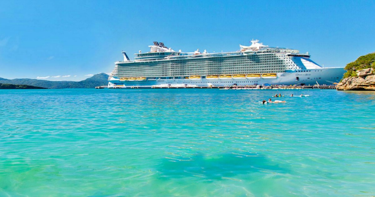 cruise ship docked at the beach