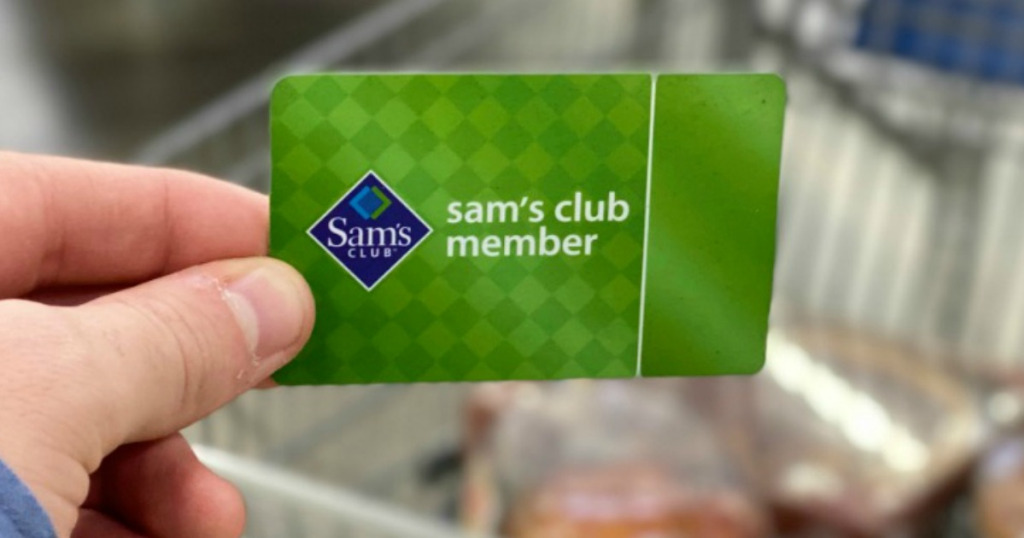 person holding Sam's Club member card