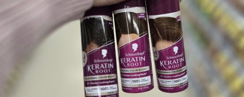 3 cans of Schwarzkopf Root Spray in hand