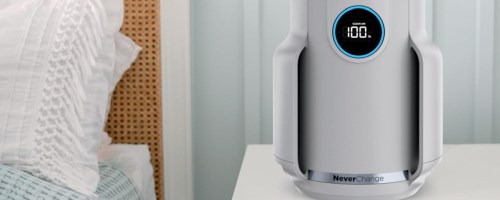 Shark never change air purifier on white nightstand next to bed