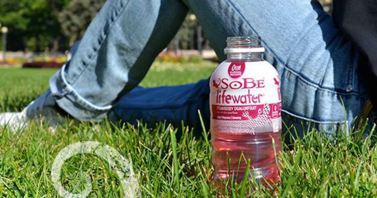 Sobe Water - Lifewater on grass with person lying beside bottle