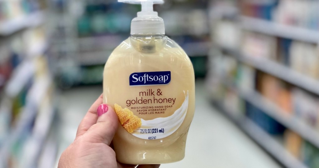 Golden honey and milk scented hand soap in bottle in-hand in store