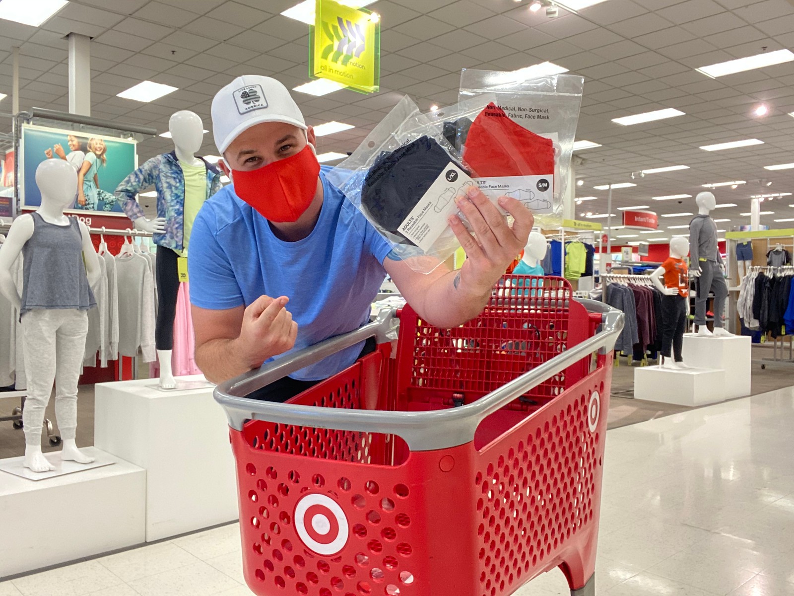 man at Target holding masks