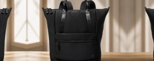 Black neoprene tote bag on wooden table top