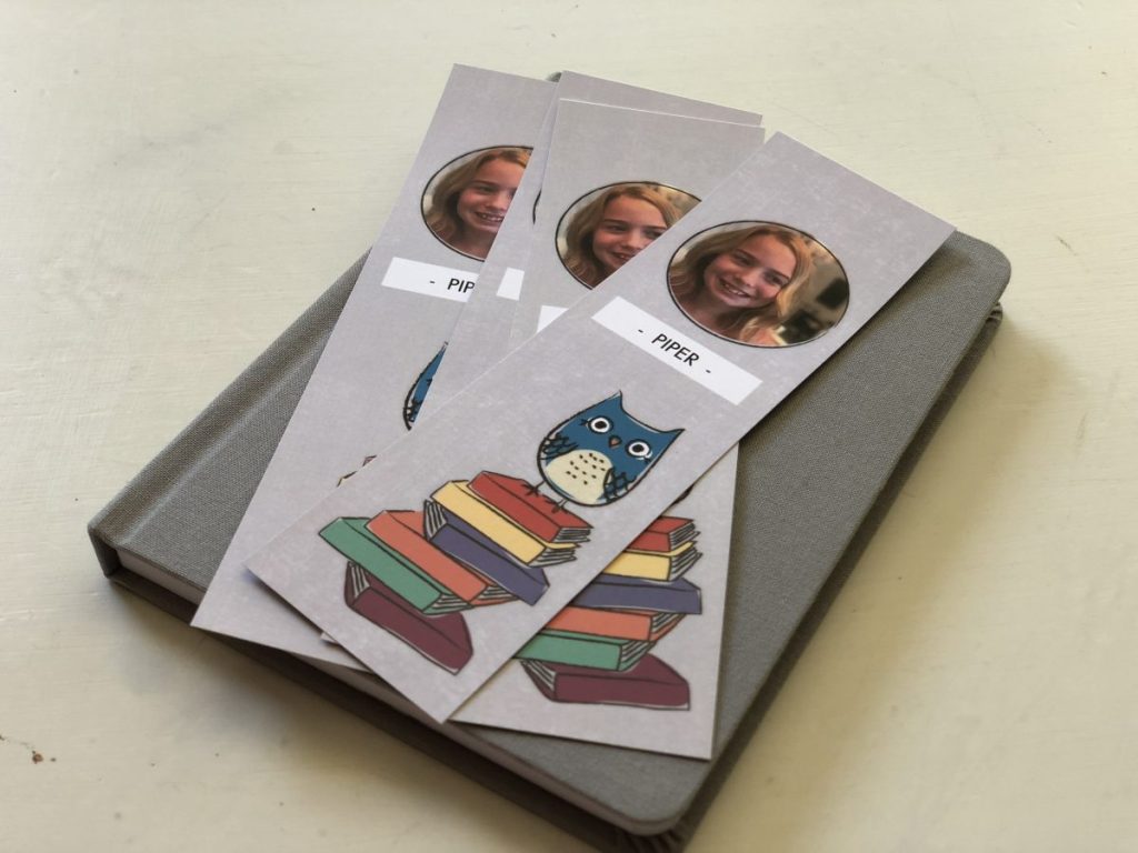 set of personalized bookmarks on top of a book