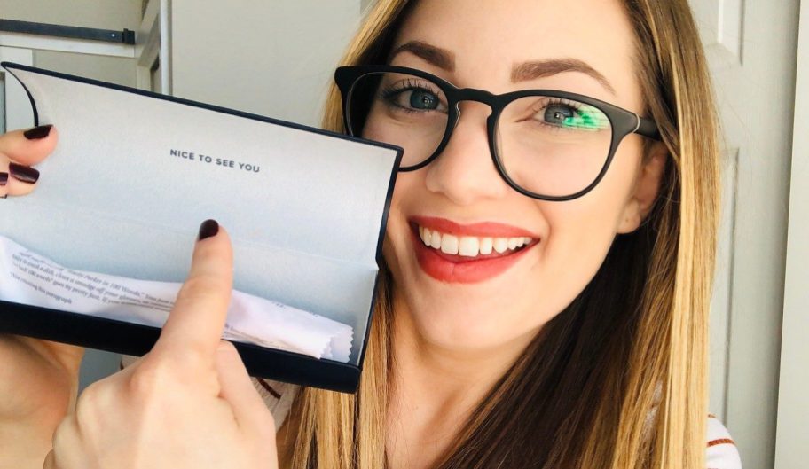 Woman holding glasses with case