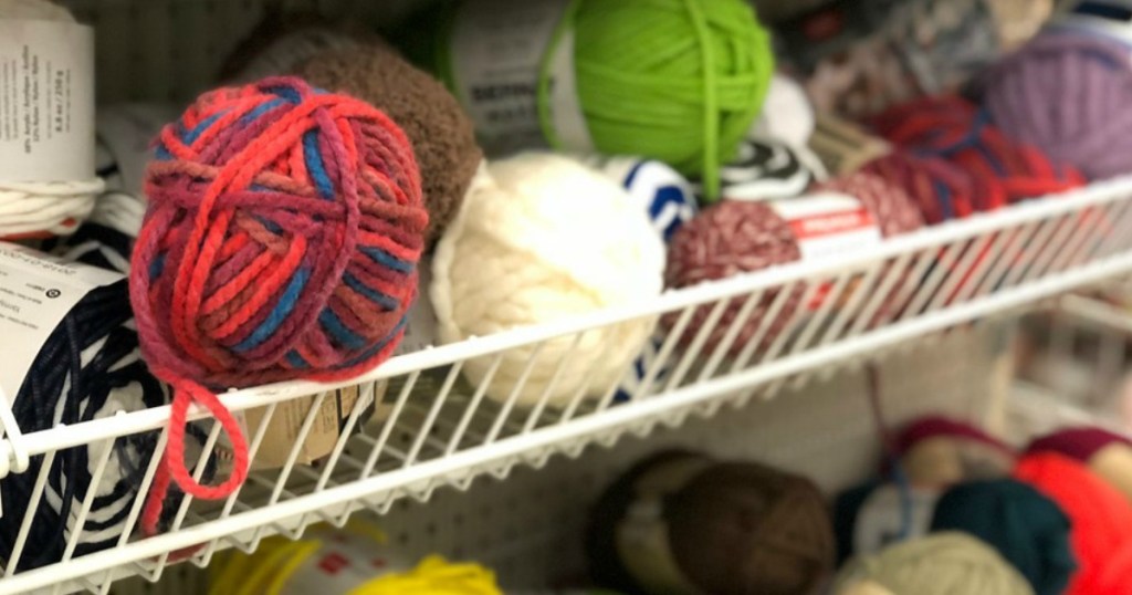 several different colors of yarn all in a bin