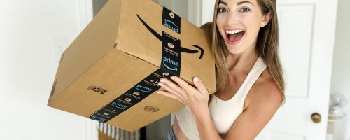 holding an Amazon prime box