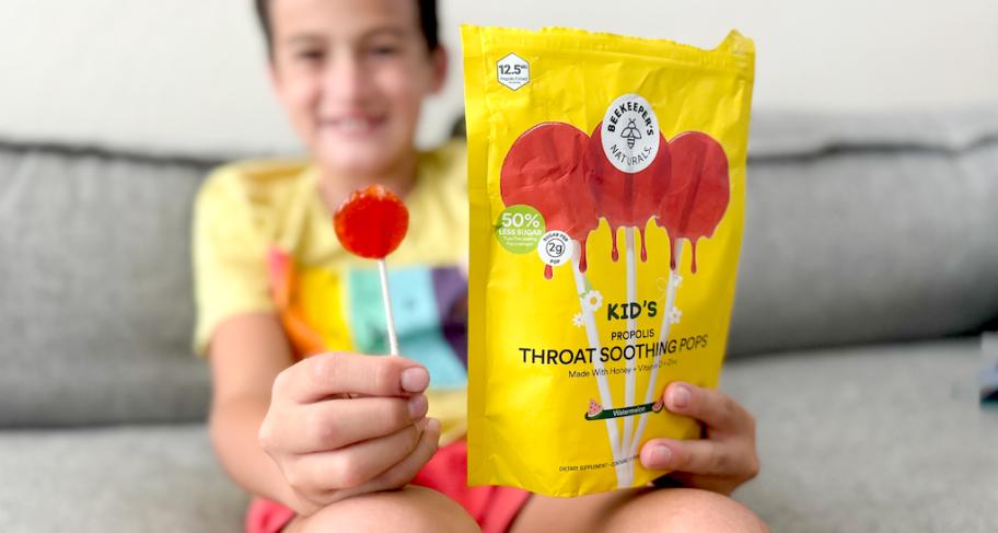 Child holding a bag of lollipops