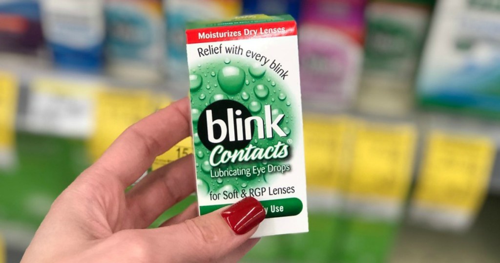 woman hand holding blink contacts package