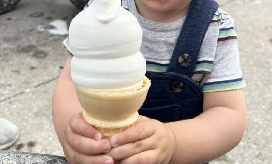 Kid holding vanilla ice cream cone
