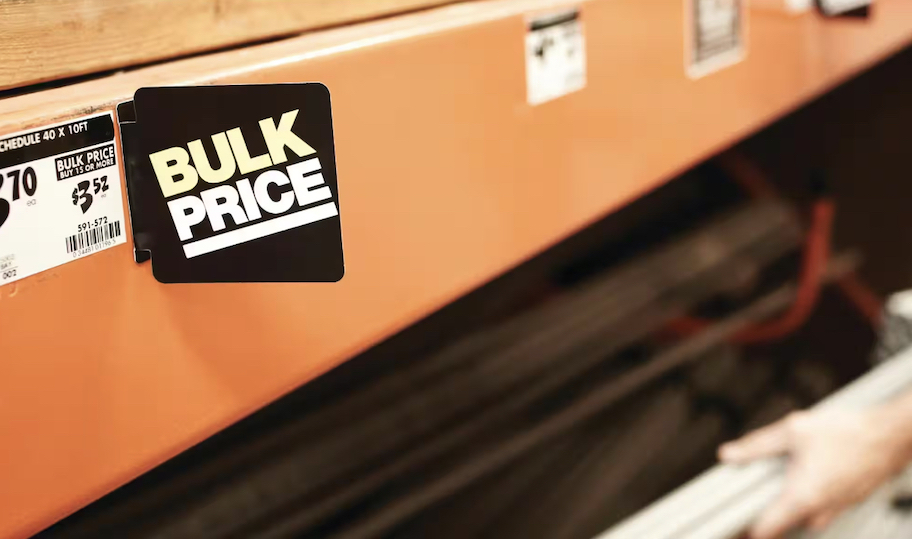 close up of bulk pricing sign on orange store shelf