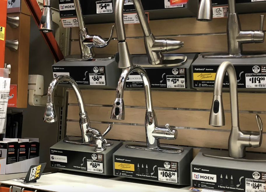 row of silver faucets on store aisle