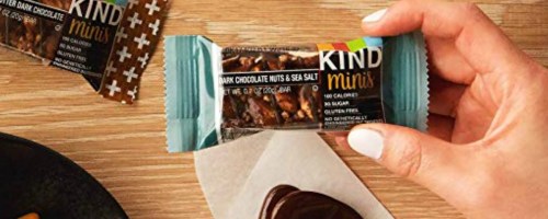 hand holding up a kind mini bar