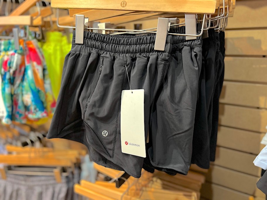 black lululemon shorts on hanger on display rack in lululemon store