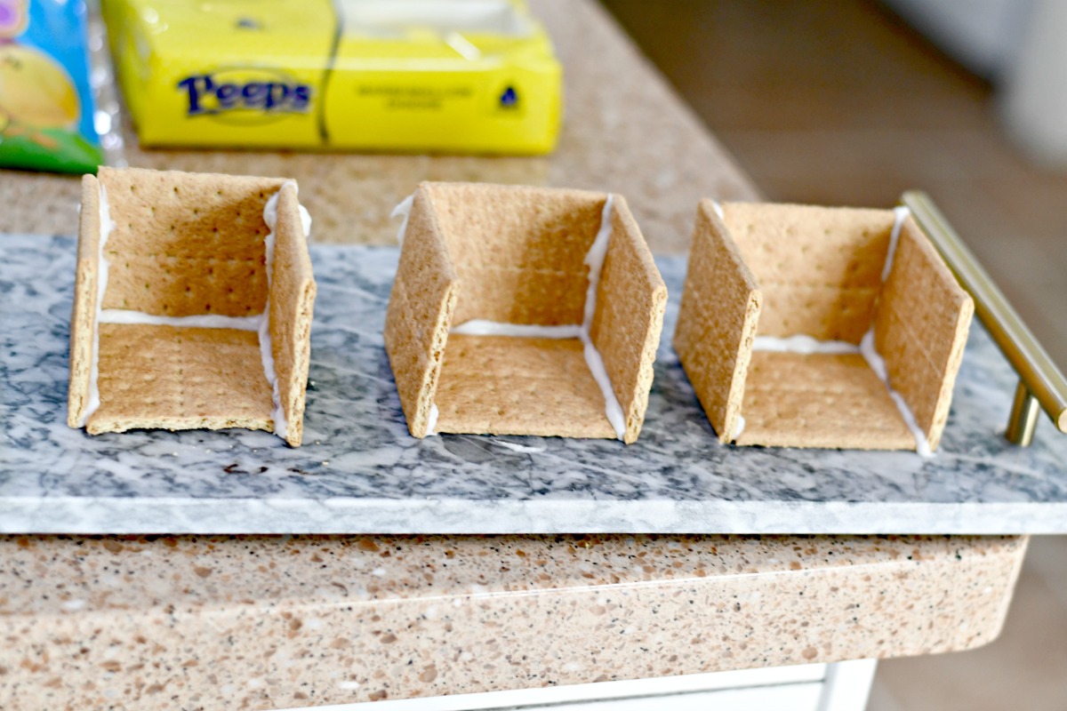 making Easter gingerbread houses with graham crackers