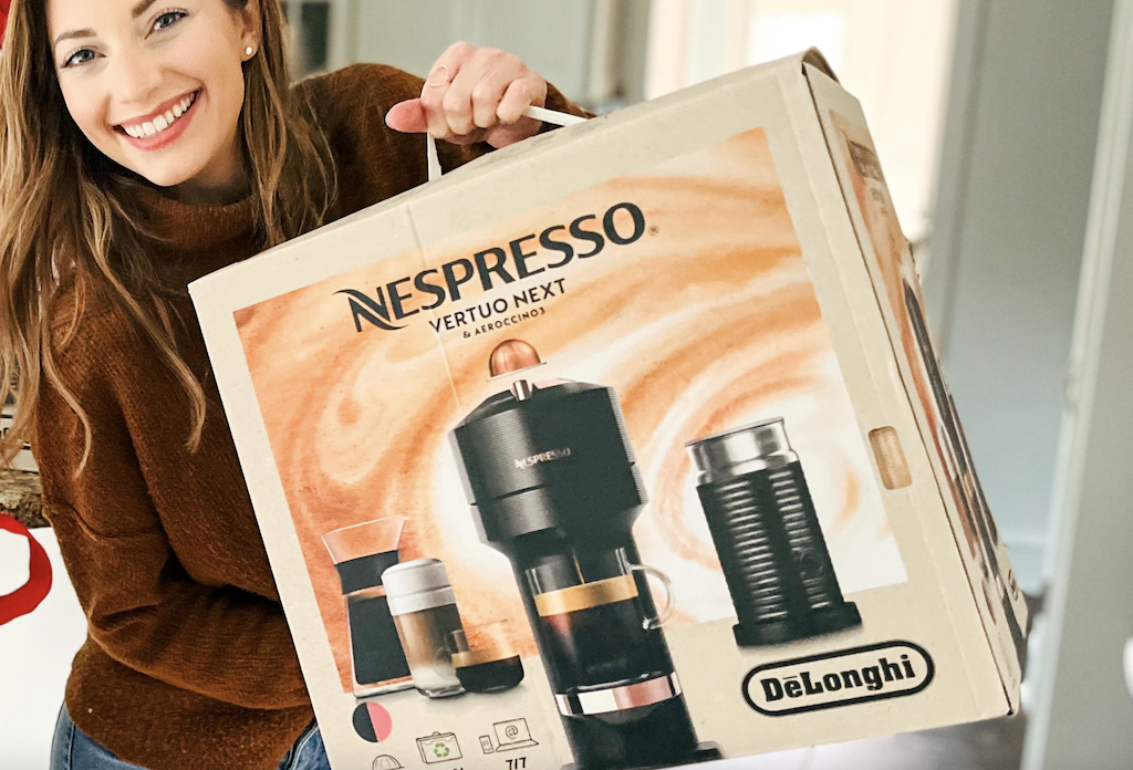 woman holding up Nespresso Vertuo Next box