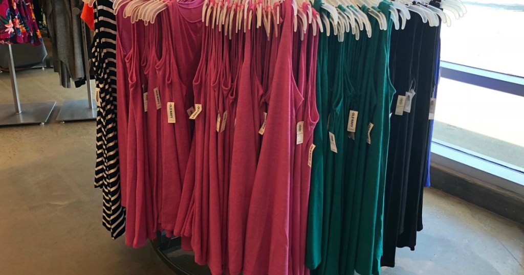 brightly colored sleeveless women's dresses on carousel rack at Old Navy