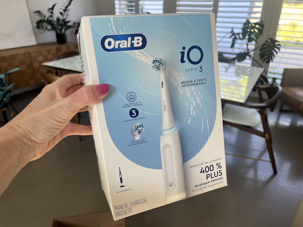 oral b io toothbrush in woman's hand