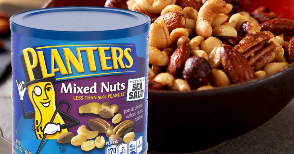 Planters Deluxe Mixed Nuts container sitting next to a bowl of nuts