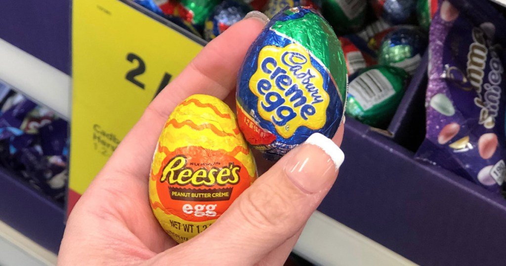 hand holding foil-wrapped eggs