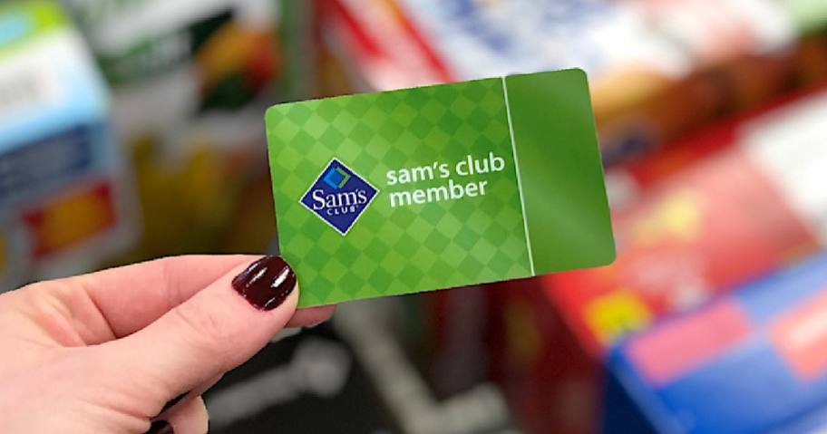 holding a Sam's Club membership card