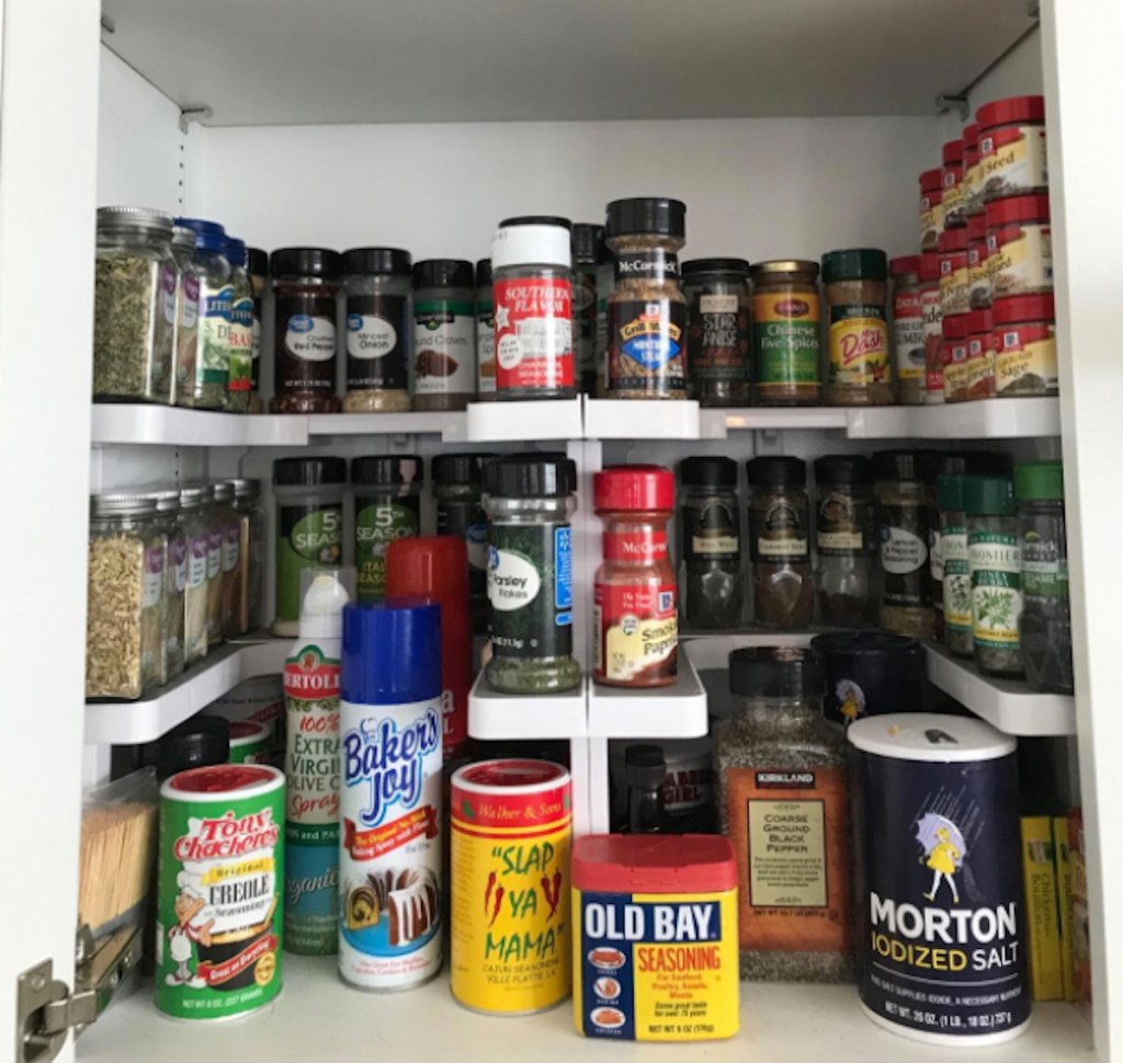 various spices in cabinet with shelves inside