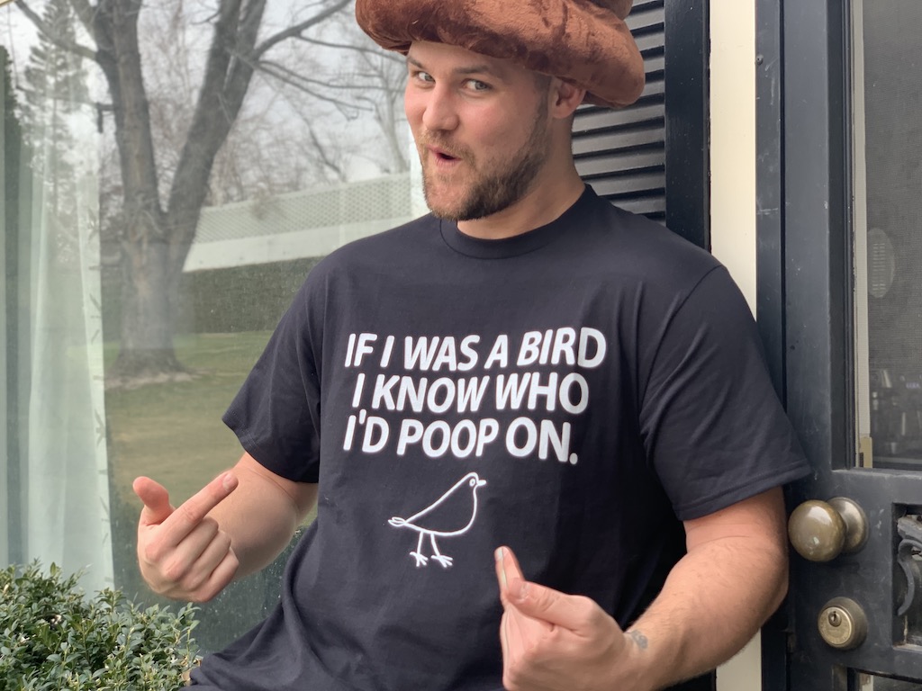 man wearing poop bird graphic tee 