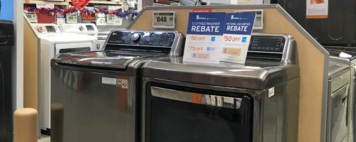 two appliances in store with the home depot rebate signs