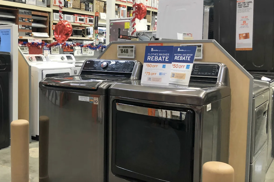 two appliances in store with the home depot rebate signs