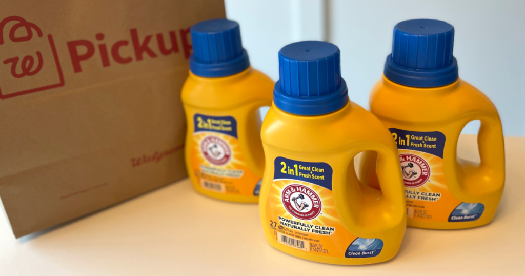 three bottles of arm & hammer laundry detergent