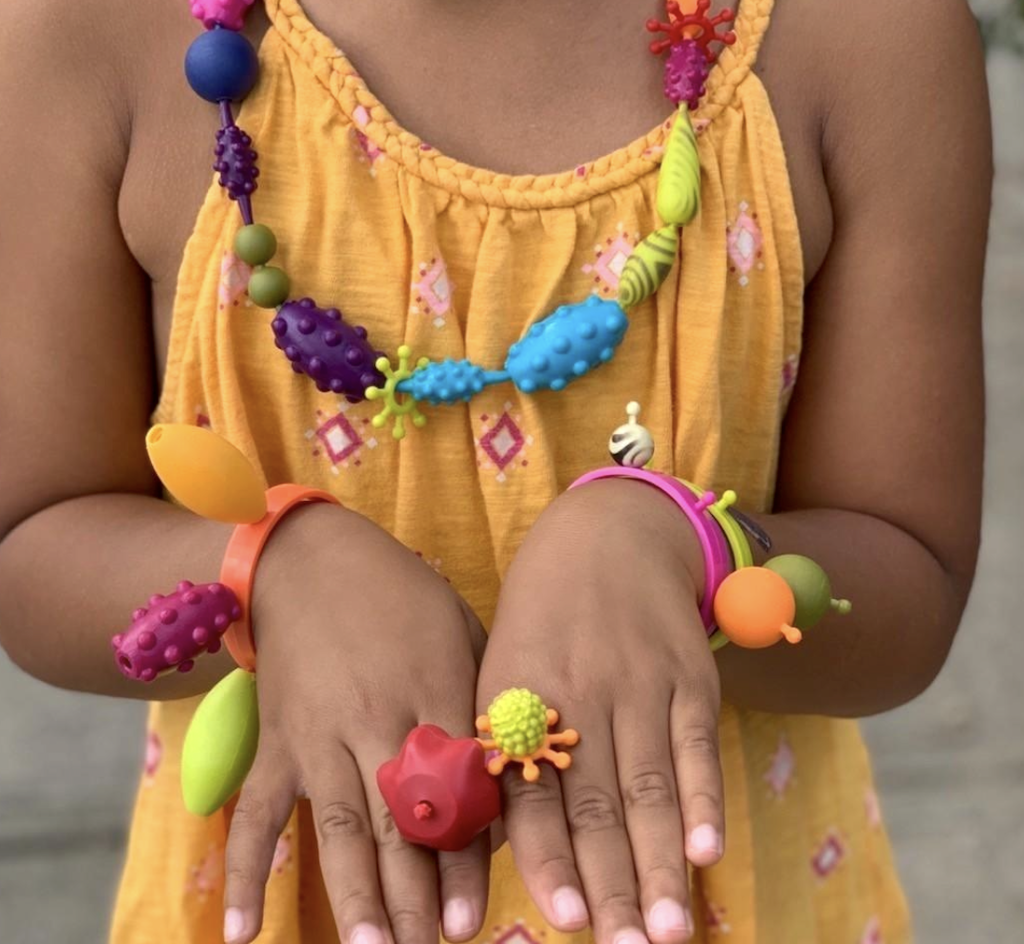 girl wearing snap bead jewelry 
