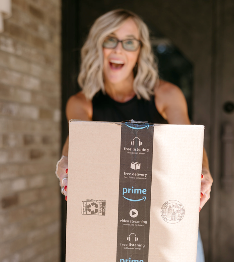 woman holding Amazon package