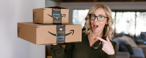 Woman pointing at Amazon boxes
