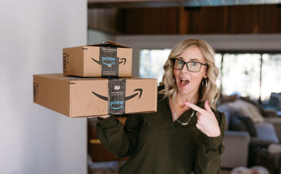 Woman pointing at Amazon boxes