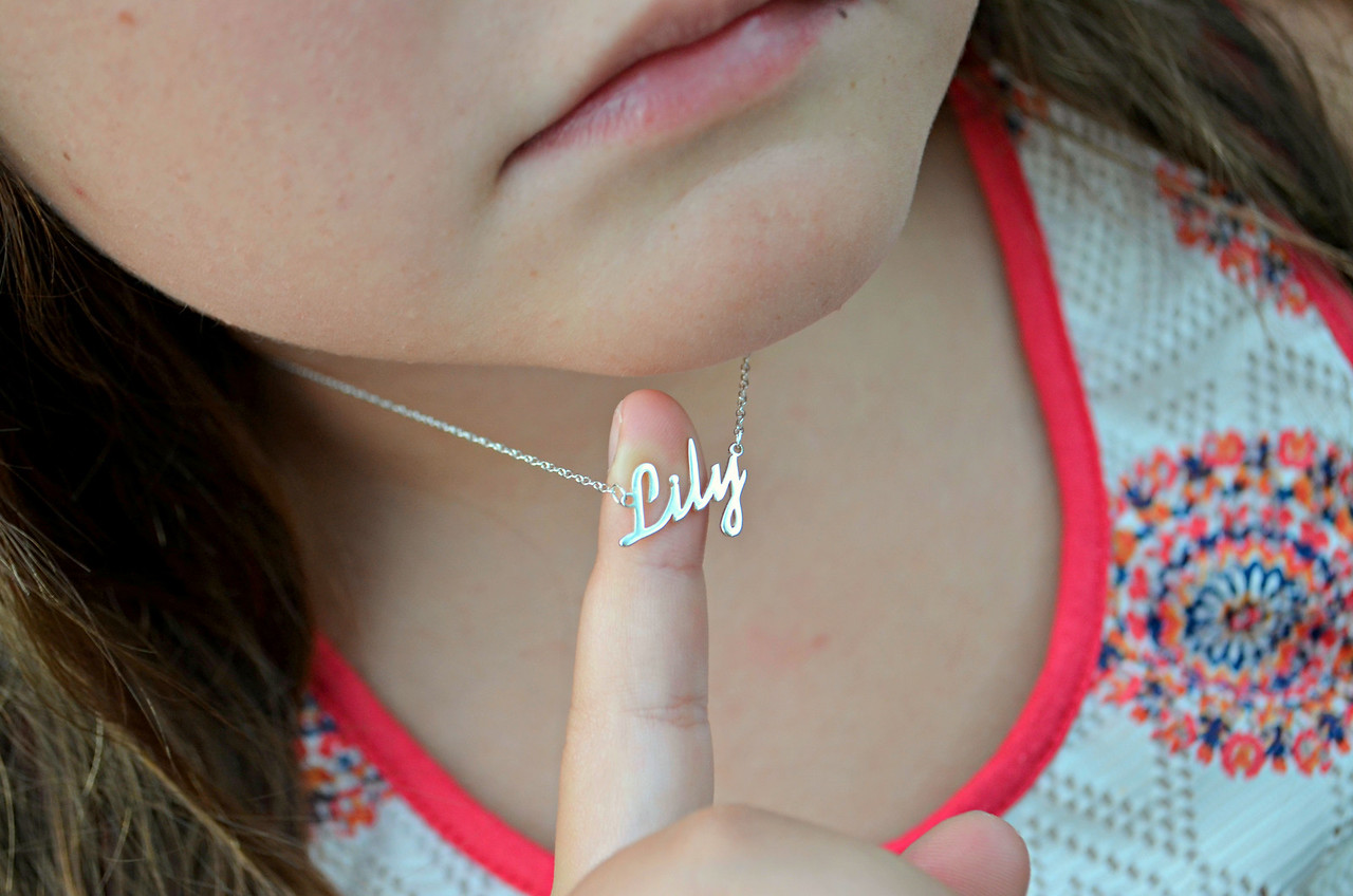 girl wearing Lily name necklace