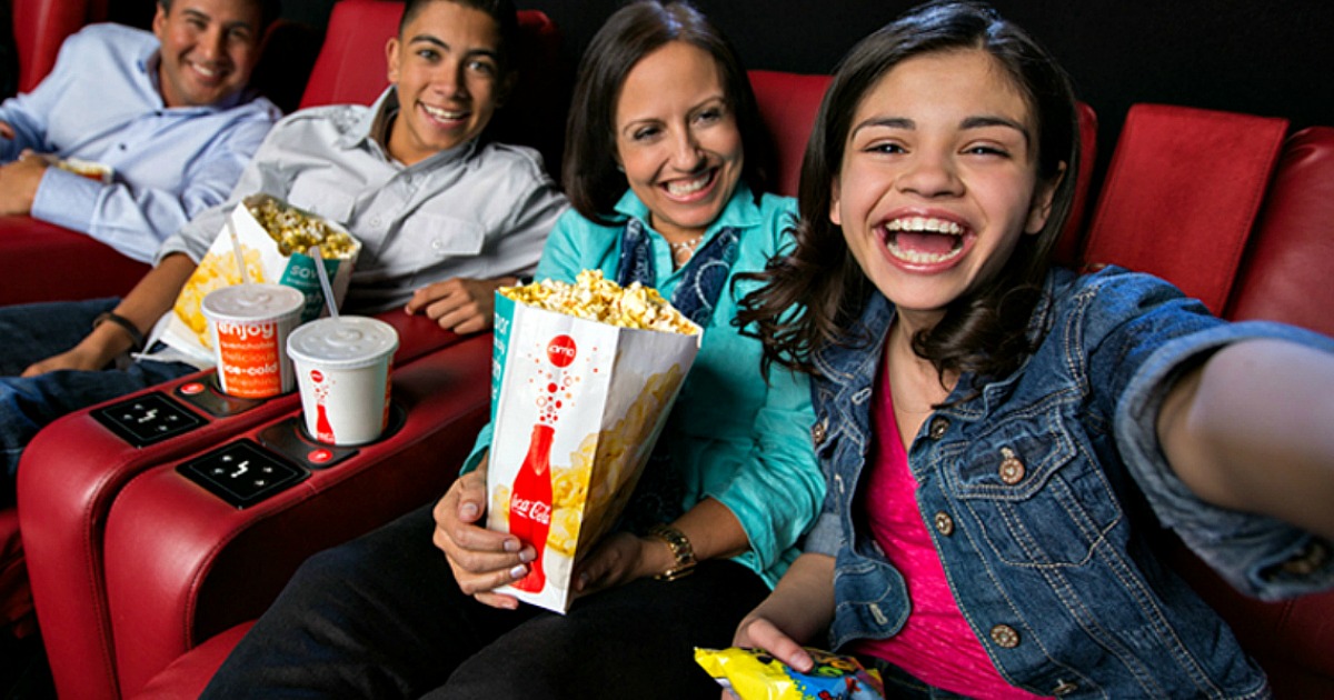 a girl taking a family selfie at the movies