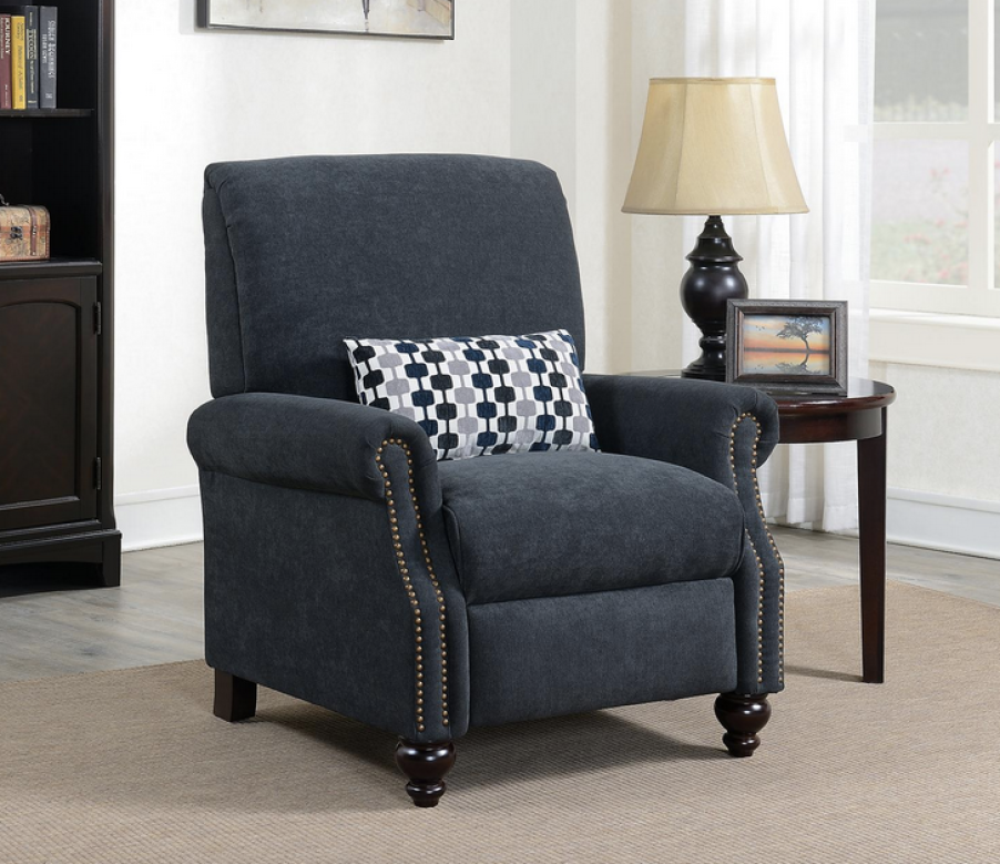 push-back recliner in dark blue from Sam's Club next to a lamp