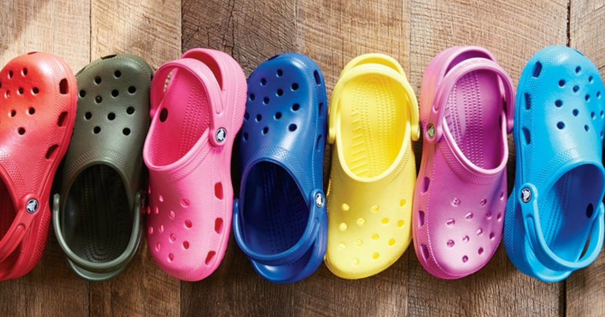 line of colorful Crocs clogs on the floor