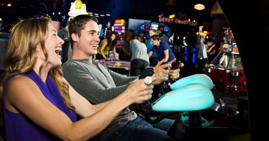 Couple having fun at Dave & Buster's game room