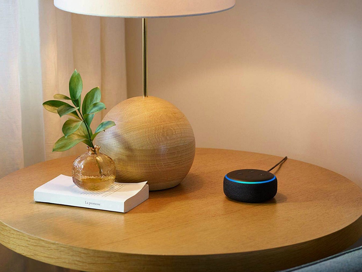 Echo dot speaker on side table next to lamp