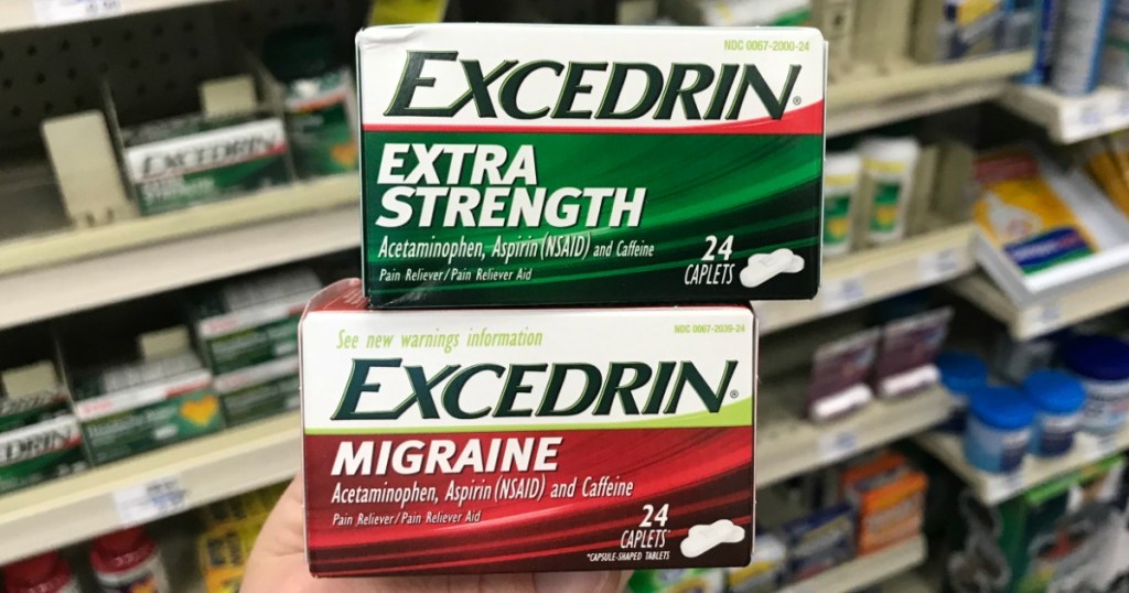 woman holding excedrin