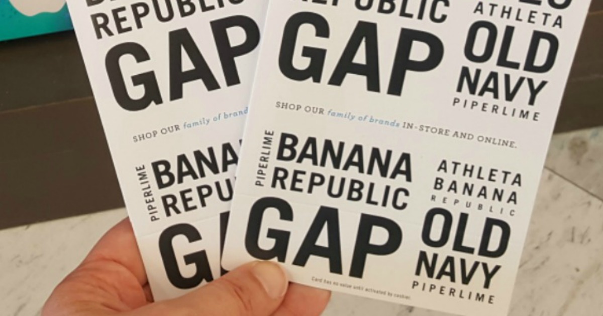 hand holding gap gift cards in store
