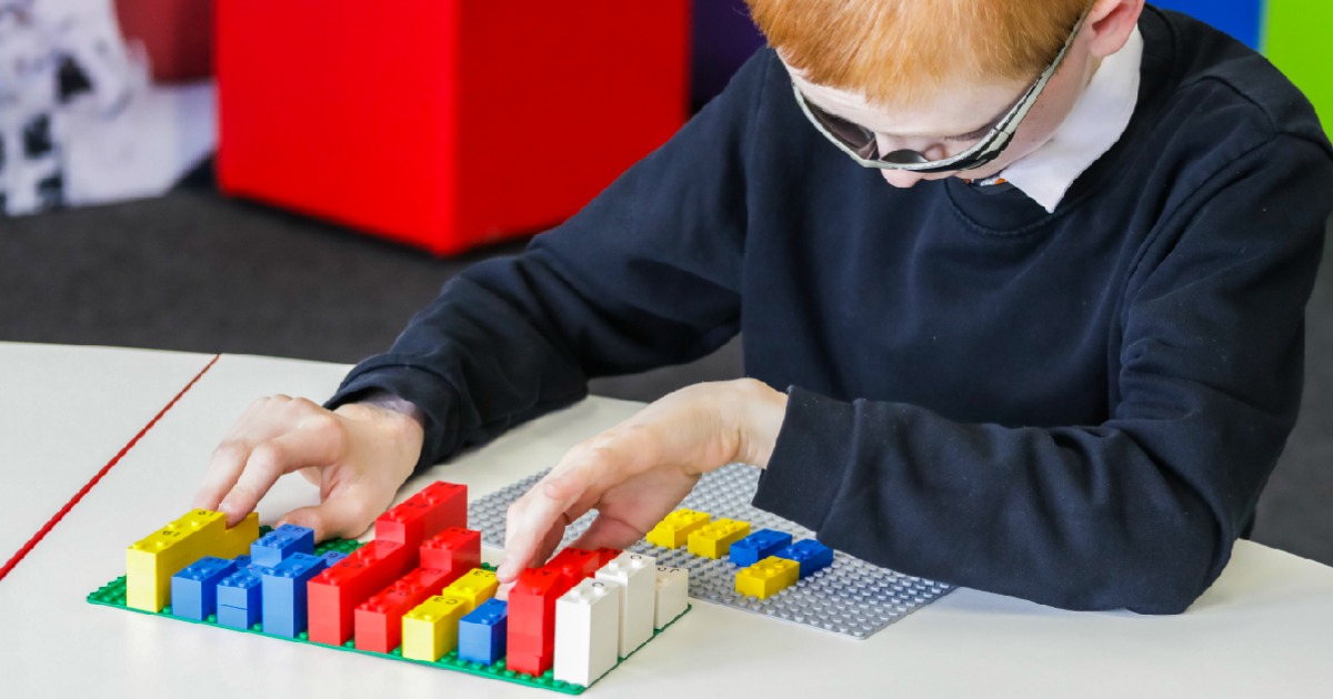 these new Lego Braille brick kits will help kids learn braille like this young boy