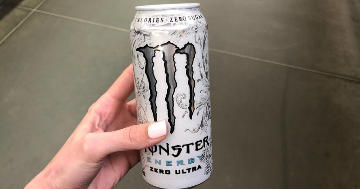 woman holding Monster Energy Drink