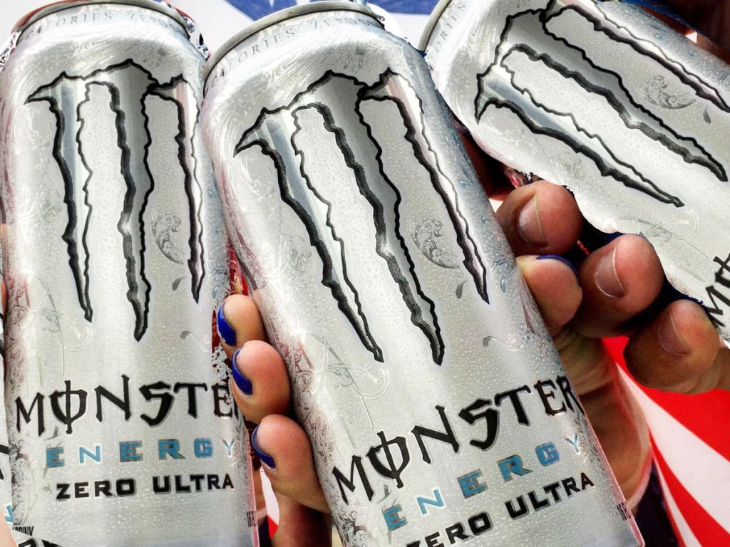 people holding cans of Monster Energy Zero Ultra drinks