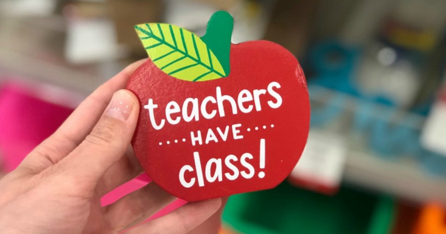 hand holding up red Teachers have class apple