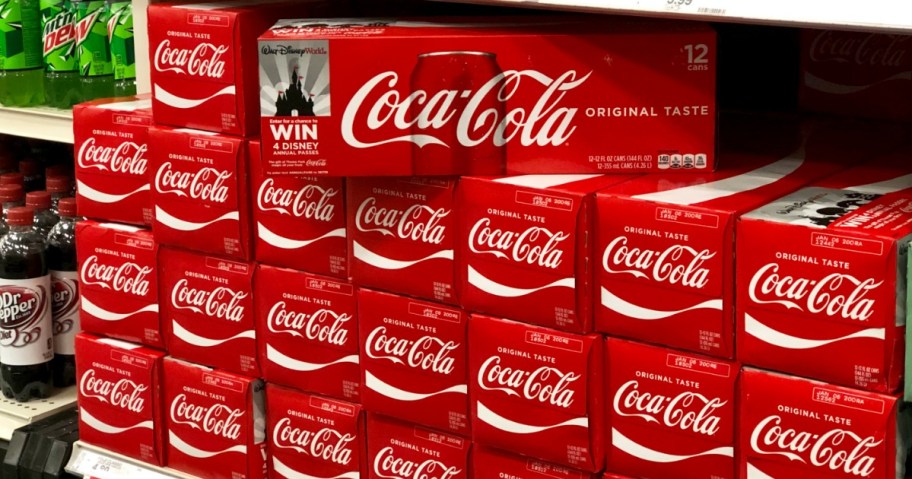 packs of coke on shelf at store