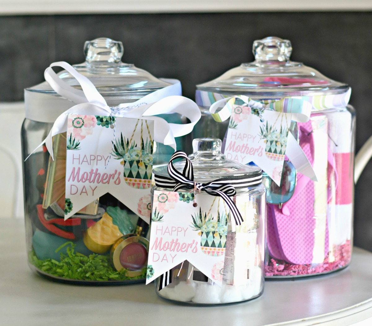 3 different diy mother's day gifts in a jar on the table